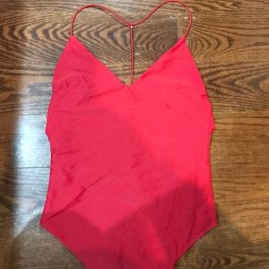 by the way red bodysuit!